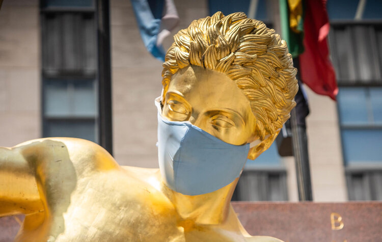 Golden Figurative Statue adorned with Covid Mask