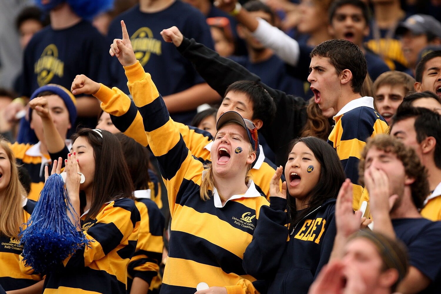 Cal sports fans cheering at a game